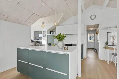 a kitchen with a blue and white counter top at BL1346-Blokhus-Septimusvej-19 in Blokhus