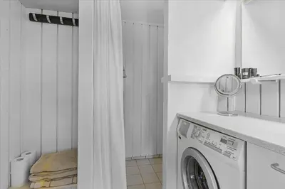 a white laundry room with a washing machine at BL1636-Saltum-Saltum-Strandvej-140 in Saltum
