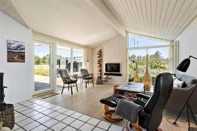 a living room with a couch and a table at BL1243-Saltum-Kvansletten-22 in Saltum