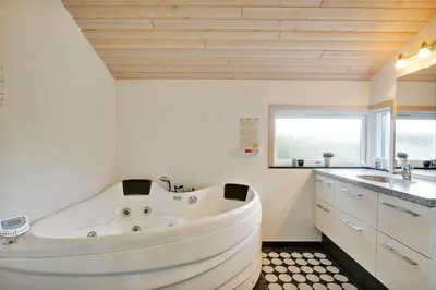 a large white tub in a bathroom with a sink at BL1299-Saltum-Bondagervej-44 in Saltum