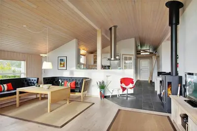 a living room with a table and a couch at BL1299-Saltum-Bondagervej-44 in Saltum