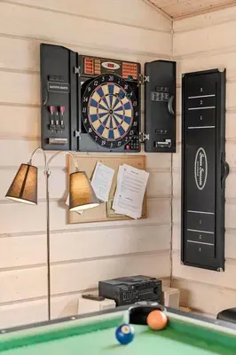 a room with a dart board and a pool table at BL842-Blokhus-Laerkevej-29 in Blokhus