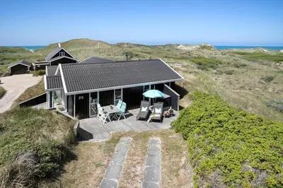 an aerial view of a house on the beach at BL1483-Blokhus-Ved-Skoven-25 in Blokhus