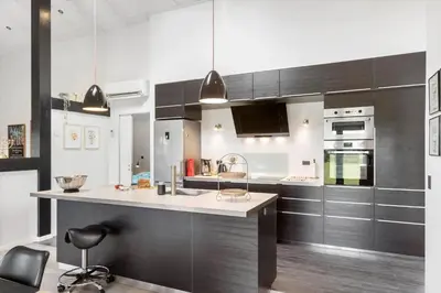 a kitchen with black cabinets and a white counter top at BL200-Saltum-Laustvej-9 in Saltum