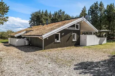 a small brown house with a roof at BL1486-Saltum-Ornebjergvej-4 in Saltum