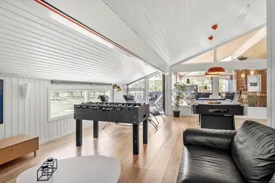 a living room with a ping pong table in it at BL1486-Saltum-Ornebjergvej-4 in Saltum