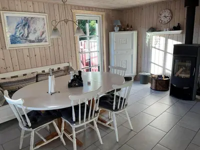 a dining room with a white table and chairs at BL1743-Pandrup-Rodhus-Skolevej-14 in Pandrup