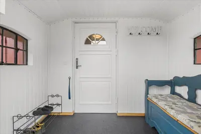a room with a door and a bed and a door at BL1743-Pandrup-Rodhus-Skolevej-14 in Pandrup