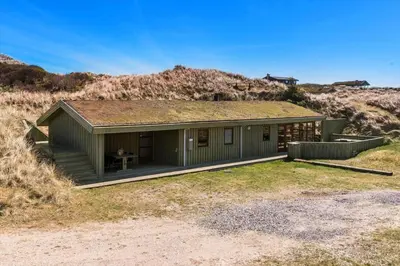 a green house with a grass roof on a field at BL1311-Saltum-Kordalsvej-90 in Saltum