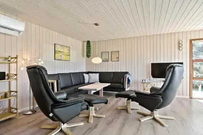 a living room with a couch and two chairs and a table at BL1311-Saltum-Kordalsvej-90 in Saltum