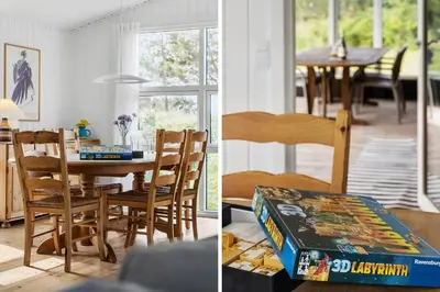 a kitchen and a dining room with a table and chairs at BL1471-Blokhus-Solbakkevej-15 in Blokhus