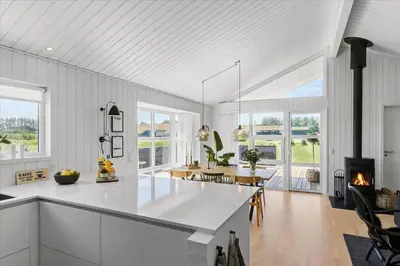 a kitchen and dining room with white walls and windows at BL479-Saltum-Laustvej-26 in Saltum