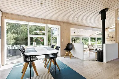 a kitchen and dining room with a table and chairs at BL1725-Saltum-Sonderborgvej-17 in Saltum