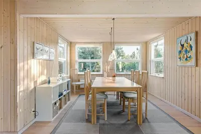 a kitchen and dining room with a table and chairs at BL1233-Saltum-Krogsletten-14 in Saltum