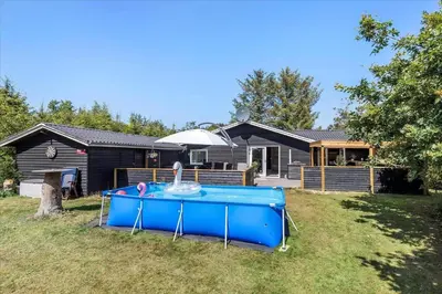 a pool table in a yard in front of a house at BL1417-Blokhus-Frederiksensvej-16 in Blokhus
