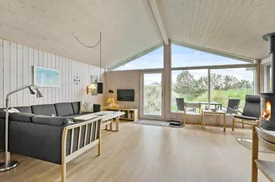 a living room with a couch and a table at BL1522-Saltum-Kordalslien-25 in Saltum