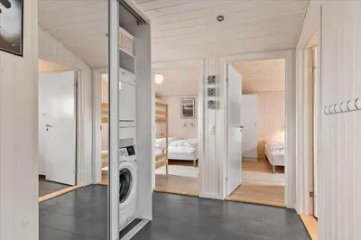a room with a washer and dryer in a house at BL239-Blokhus-Klitgaardsvej-21 in Blokhus