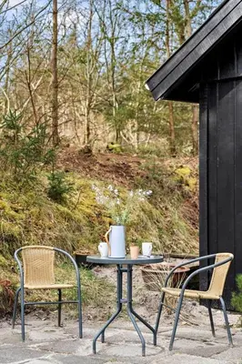 a table and two chairs and a table and chairs at BL353-Blokhus-Kragebak-1 in Blokhus