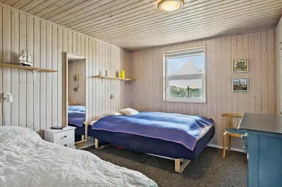 a bedroom with two beds and a window at BL678-Saltum-Lemmingvej-10 in Saltum