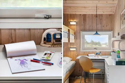 a kitchen and a room with a desk with a laptop at BL1329-Blokhus-Pirupshvarrevej-67 in Blokhus
