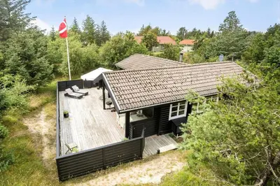 an overhead view of a house with a flag at BL1610-Blokhus-Soren-Petersvej-20 in Blokhus