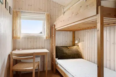 a small room with a desk and bunk beds at BL1394-Pandrup-Tunen-2 in Pandrup