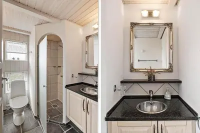 a bathroom with a sink and a mirror at BL168-Saltum-Taarnfalkevej-11 in Saltum