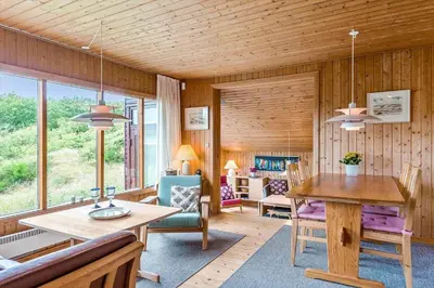 a living room with a table and chairs and a dining room at BL1568-Saltum-P-Ejerstedgaardsvej-1-A in Saltum