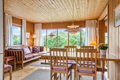 a living room with a table and chairs and a couch at BL1568-Saltum-P-Ejerstedgaardsvej-1-A in Saltum