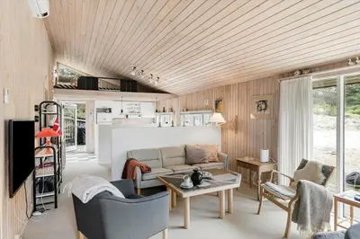 a living room with a couch and a table at BL1202-Saltum-Revlingevej-6 in Saltum
