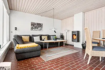 a living room with a couch and a table at BL1397-Pandrup-Rodhus-Klitvej-363 in Pandrup