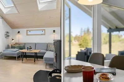 a living room with a couch and a table at BL1272-Pandrup-Kirkekrogen-7 in Pandrup