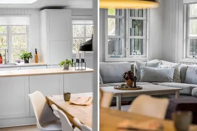 a living room with a couch and a table at BL1280-Blokhus-Bloksbjerg-50 in Blokhus
