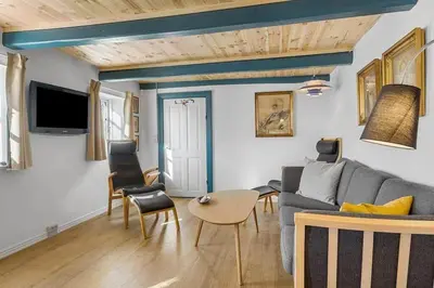 a living room with a couch and a table at BL1249-Pandrup-Rodhus-Klitvej-80 in Pandrup