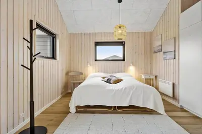 a bedroom with a bed and a window at BL1288-Saltum-Tolhoj-48 in Saltum