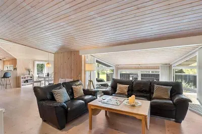 a living room with two leather couches and a coffee table at BL1293-Saltum-Havmandens-Vej-24 in Saltum