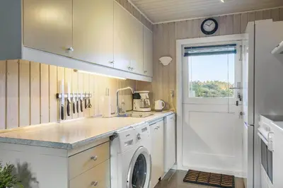 a kitchen with a washing machine and a sink at BL1523-Saltum-Skanderborgvej-14 in Saltum