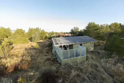 a small house with people inside of it in a field at BL1523-Saltum-Skanderborgvej-14 in Saltum