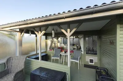 a patio with awning and a table and chairs at BL1523-Saltum-Skanderborgvej-14 in Saltum