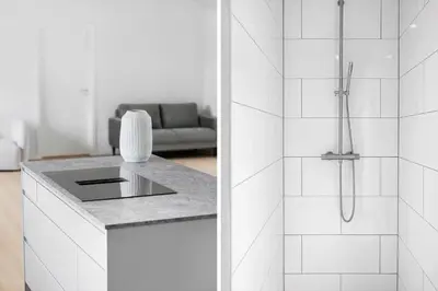 a white bathroom with a shower and a sink at BL1108-Saltum-Vesterhavs-Sletten-45 in Saltum