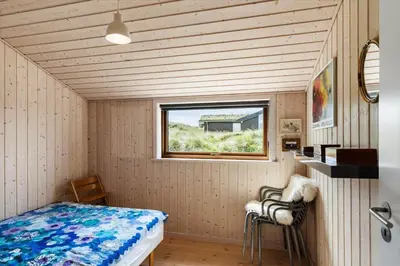 a small room with a bed and a window at BL1104-Saltum-Borgvej-45 in Saltum