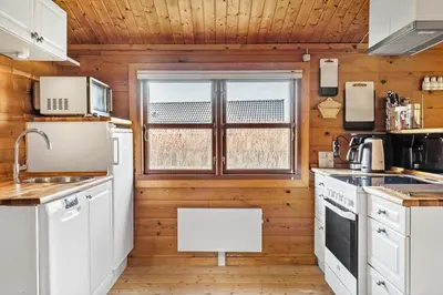 a kitchen with white appliances and a window at G151-Lemvig-Porsevej-51 in Lemvig