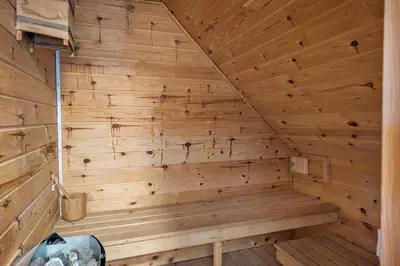 a wooden sauna with a wooden wall at 258-Harboore-Merchantvej-5 in Harboør