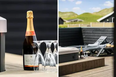 a bottle of champagne sitting on top of a table at 258-Harboore-Merchantvej-5 in Harboør