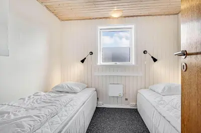 a bedroom with two beds and a window at G430-Lemvig-Myntevej-30 in Lemvig