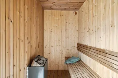 a wooden sauna with a trash can in it at 336-Harboore-Hvilehjemsvej-23 in Harboør
