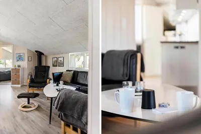 a living room with a couch and a table at 168-Harboore-Emblavej-1 in Harboør