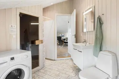 a bathroom with a washing machine and a sink at 168-Harboore-Emblavej-1 in Harboør