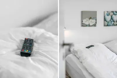 a remote control sitting on top of a bed at 159-Harboore-Alkajavej-6 in Harboør