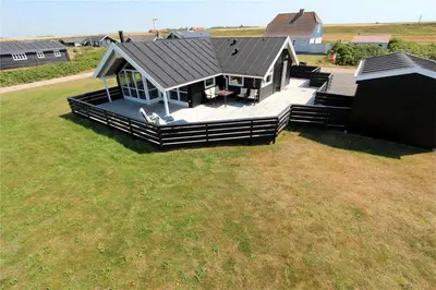 an overhead view of a house with a large yard at 507-Lemvig-Lyngsletten-11 in Lemvig